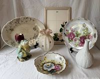 Group shot of all seven porcelain and ceramic pieces