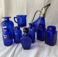 Group shot of all nine cobalt blue glass pieces