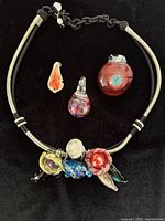 Necklace front view with loose pendants displayed