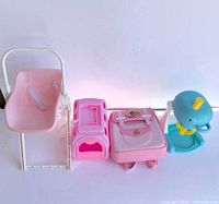 Group of four doll accessories lined up
