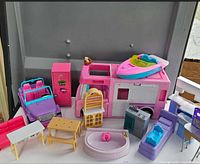 Overall lot showing camper, jeep, boat, pool and furniture pieces