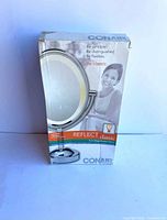 Box front showing Conair Reflect Classic mirror details