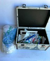 Open Paris motif box with sewing items and Jo-Ann bag beside