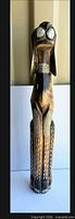 Full view of carved wooden dog doorstop