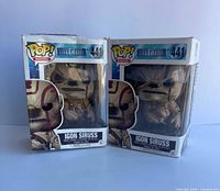 Front view of two boxed Igon Siruss Funko Pop figures