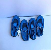 Top view of two pairs blue swim slippers
