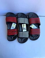 Top view three pairs slide sandals