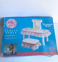 Front of retail box showing Satin 'n Lace Vanity Table product image and branding
