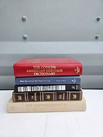 Full stack of five books showing spines