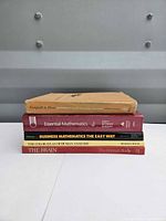 Stacked view all five book spines visible
