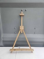 full view of wooden A-frame easel standing