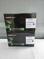 Front view of two sealed Coast to Coast Diamond toner cartridge boxes stacked