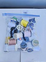 Bag containing 32 assorted thread spools