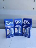 Front view of three sealed Dr. Bronner’s Joy! Peppermint Essentials Gift Sets