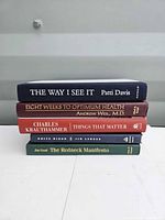 Stack of all five hardcover books showing spines