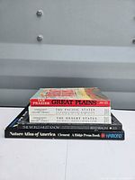 Stack of five books showing titles and spines