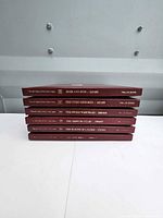 Stack of six burgundy Time-Life history books spine view