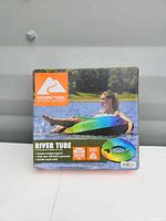 Front of retail box displaying Ozark Trail River Tube with rider image