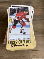 Stack of PowerPlay hockey cards with top card Chris Chelios