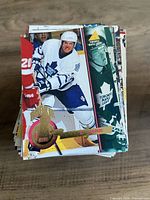 Stack of Pinnacle Gold hockey cards, top card featuring Toronto Maple Leafs rookie