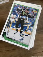 Stack of hockey trading cards with top card Upper Deck Mike Craig Dallas Stars