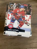 Stack of Pro Set hockey cards topped by John LeClair rookie