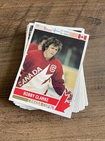 Stack of 1976 Canada Cup hockey cards with Bobby Clarke card on top