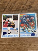 Front view of two Alexandre Daigle Classic Four Sport hockey cards