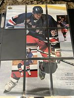 Eight of nine Wayne Gretzky NHL Career Collage cards arranged in binder page, one slot empty