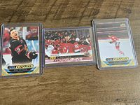 Three UD Canvas hockey cards in sleeves on table; Great Expectations, Young Guns and base variations visible