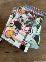 stack of mixed hockey cards featuring Boston Bruins player and others
