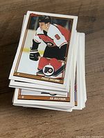 Stack of Topps NHL hockey trading cards, top card Pelle Eklund, second card Ed Belfour