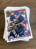 Stack of Upper Deck hockey cards, top card Glenn Healy New York Islanders
