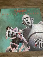 Front cover of Queen News of the World vinyl LP showing artwork
