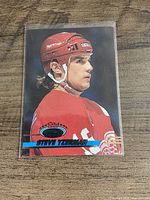 Front view of Topps Steve Yzerman hockey card in sleeve