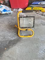 Front view showing stand, lens, wire cage, overall wear