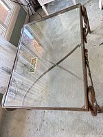 Top view showing rectangular clear glass surface and metal frame