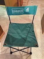 Front view of green Unimate folding chair