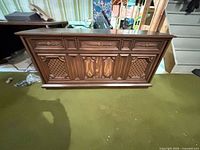 Front view of wood stereo console closed