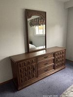 Front view of dresser with mirror attached