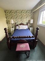 overall view of bed frame, nightstands, lamps and footstool