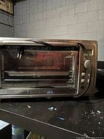 Front view of Black+Decker toaster oven with power cord visible