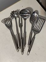 All six stainless steel utensils displayed side-by-side