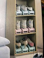 Box showing assembled shoe organizers with shoes