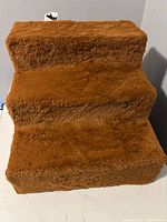 Front view showing three brown faux-fur covered steps
