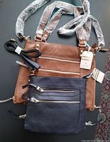 Both Oasis purses with straps visible