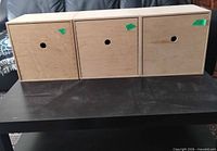 Three IKEA Moppe drawer boxes side by side, drawers closed