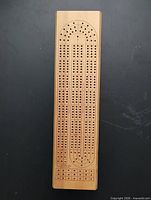 Top view showing full cribbage board track and wood finish