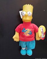 Front view of Bart Simpson plush doll with tag