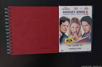 Notebook and sealed DVD side by side
